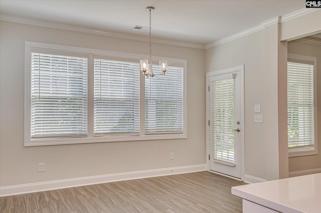 20 Belfast Ct, North Augusta, SC 29860 - unfurnished dining area with a chandelier, light wood finished floors, and crown molding