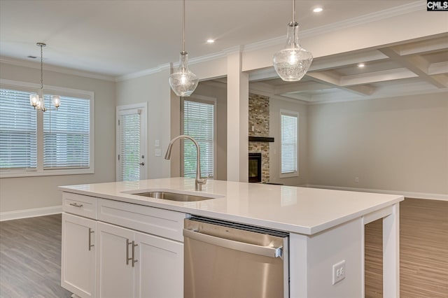 20 Belfast Ct, North Augusta, SC 29860 - kitchen with stainless steel dishwasher, open floor plan, light wood-type flooring, a fireplace, and crown molding