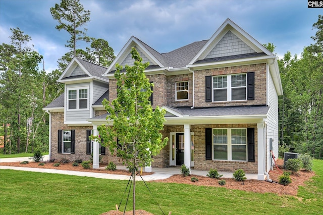 20 Belfast Ct, North Augusta, SC 29860 - craftsman-style home with a front lawn, a porch, brick siding, and roof with shingles