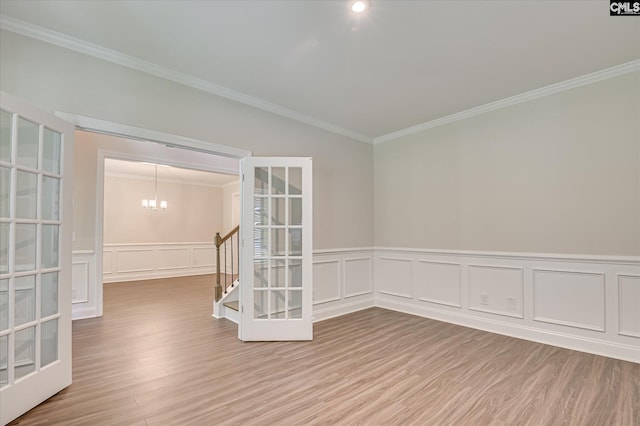 20 Belfast Ct, North Augusta, SC 29860 - spare room with ornamental molding, wood finished floors, a chandelier, a decorative wall, and a wainscoted wall