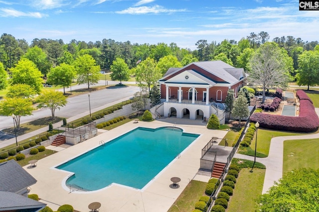 20 Belfast Ct, North Augusta, SC 29860 - rear view of house with stairs, a patio area, and a community pool