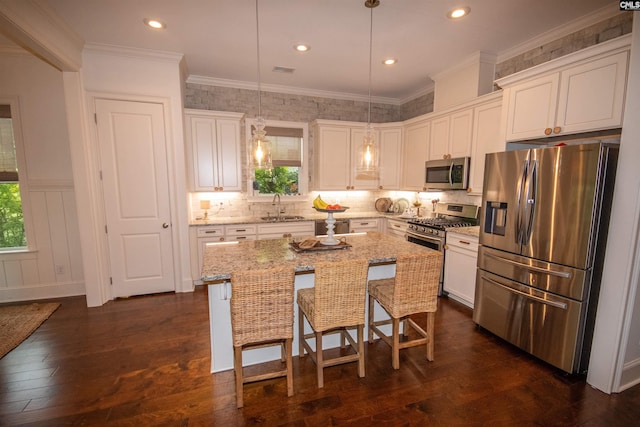 221 Coldwater Xing, Lexington, SC 29072 - kitchen featuring stainless steel appliances, white cabinets, dark wood-style flooring, recessed lighting, and crown molding