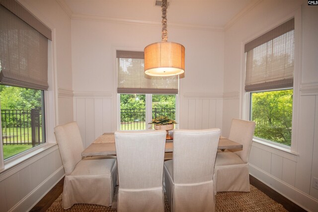 221 Coldwater Xing, Lexington, SC 29072 - dining area with wood finished floors, a decorative wall, healthy amount of natural light, wainscoting, and ornamental molding