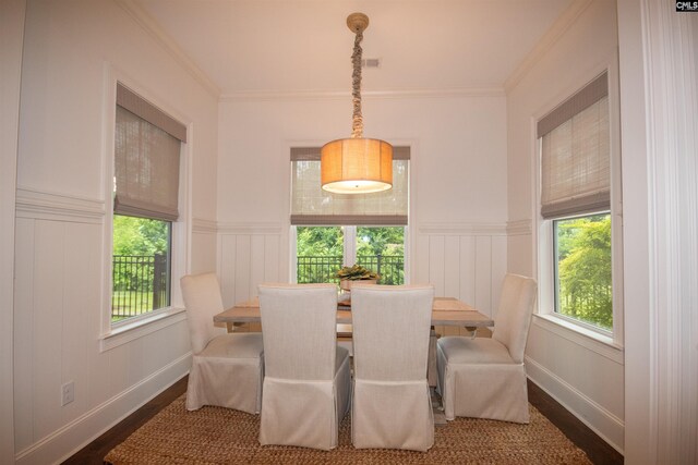 221 Coldwater Xing, Lexington, SC 29072 - dining room featuring wood finished floors, healthy amount of natural light, a decorative wall, ornamental molding, and a wainscoted wall