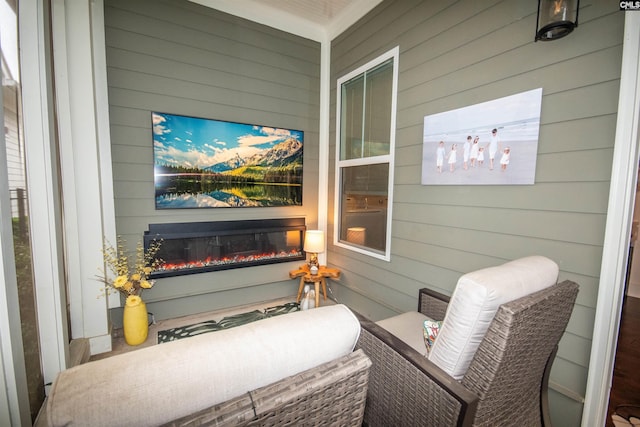 221 Coldwater Xing, Lexington, SC 29072 - living area with wooden walls and a glass covered fireplace
