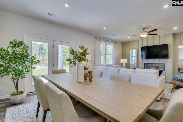 182 Scruple Way, North Augusta, SC 29860 - dining room featuring wood finished floors, recessed lighting, a ceiling fan, and a large fireplace