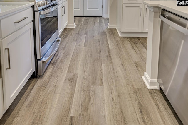 182 Scruple Way, North Augusta, SC 29860 - kitchen featuring appliances with stainless steel finishes, light wood-style flooring, white cabinetry, and light countertops