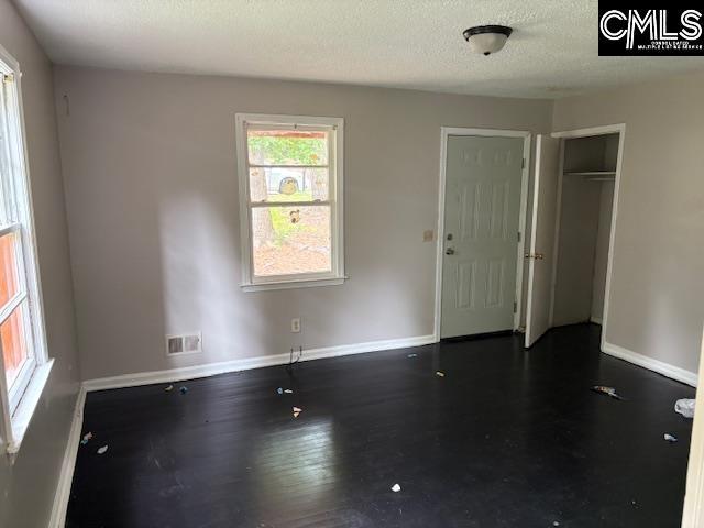 116 Larchwood Dr, Columbia, SC 29203 - empty room with a textured ceiling and wood finished floors