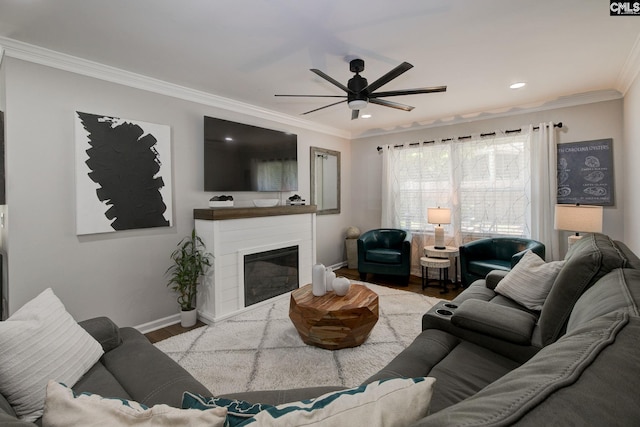 1601 Hagood Ave, Columbia, SC 29204 - living area featuring wood finished floors, ornamental molding, a ceiling fan, recessed lighting, and a glass covered fireplace