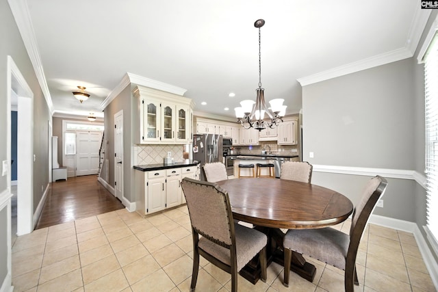 100 Morning Echo Dr, Columbia, SC 29229 - dining room featuring a chandelier, ornamental molding, light tile patterned floors, and recessed lighting
