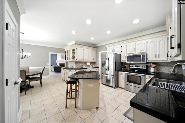 100 Morning Echo Dr, Columbia, SC 29229 - kitchen with stainless steel appliances, a breakfast bar, dark countertops, decorative backsplash, and light tile patterned floors