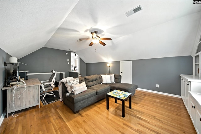 100 Morning Echo Dr, Columbia, SC 29229 - living area featuring a ceiling fan, light wood finished floors, lofted ceiling, and a textured ceiling