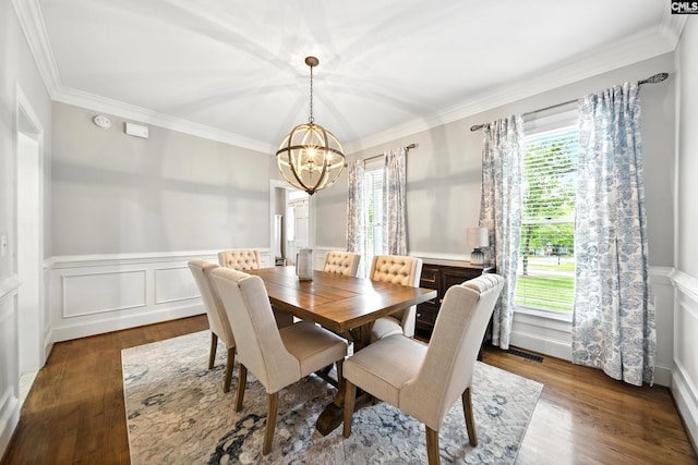 100 Morning Echo Dr, Columbia, SC 29229 - dining space featuring a chandelier, ornamental molding, wainscoting, wood finished floors, and a decorative wall