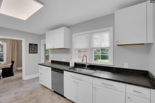 608 Byron Rd, Columbia, SC 29209 - kitchen featuring dishwasher, plenty of natural light, dark countertops, and white cabinets