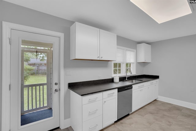 608 Byron Rd, Columbia, SC 29209 - kitchen featuring dishwasher, dark countertops, and white cabinets