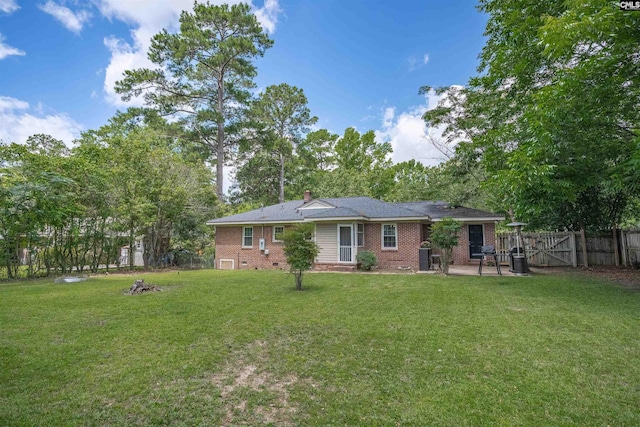 608 Byron Rd, Columbia, SC 29209 - rear view of property featuring brick siding, a chimney, and a gate