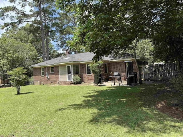 608 Byron Rd, Columbia, SC 29209 - rear view of house featuring brick siding, a patio area, a gate, and a chimney