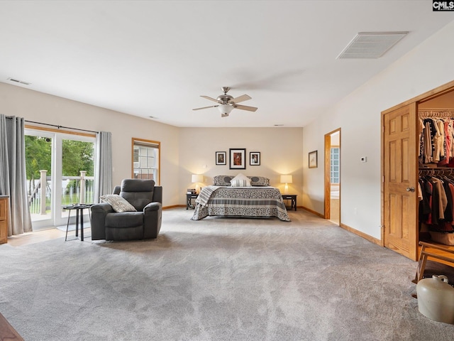 887 Living Waters, Great Falls, SC 29055 - bedroom featuring access to exterior, carpet floors, a ceiling fan, and a walk in closet