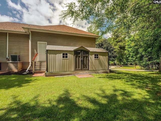 887 Living Waters, Great Falls, SC 29055 - back of house with entry steps, a yard, and roof with shingles