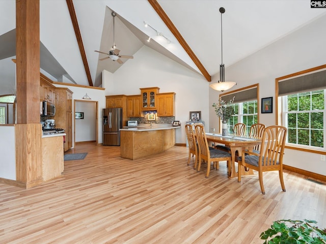 887 Living Waters, Great Falls, SC 29055 - dining space with light wood-style flooring, high vaulted ceiling, beam ceiling, and ceiling fan
