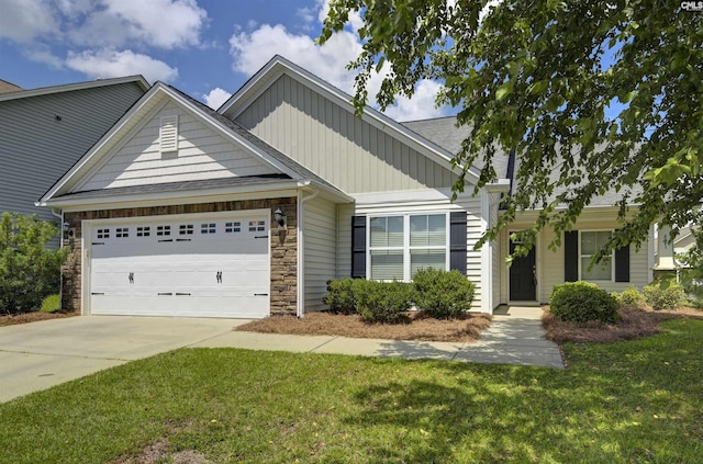 821 Burnview Ln, Chapin, SC 29036 - view of front of property with an attached garage, a front yard, concrete driveway, board and batten siding, and stone siding