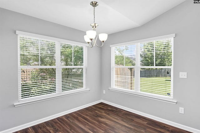 821 Burnview Ln, Chapin, SC 29036 - empty room with a chandelier, dark wood-type flooring, and vaulted ceiling