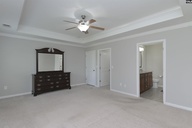 821 Burnview Ln, Chapin, SC 29036 - unfurnished bedroom with a tray ceiling, light colored carpet, ornamental molding, connected bathroom, and ceiling fan