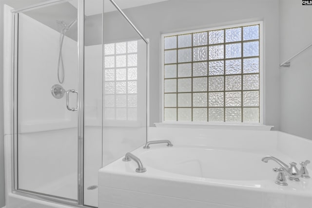 821 Burnview Ln, Chapin, SC 29036 - full bathroom with a shower stall, a garden tub, and healthy amount of natural light