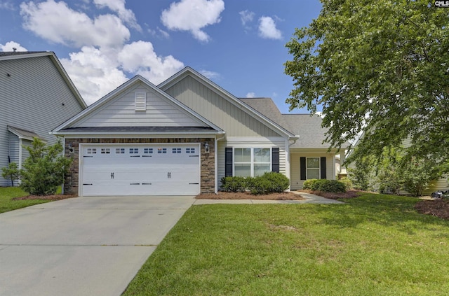 821 Burnview Ln, Chapin, SC 29036 - view of front of home featuring a garage, board and batten siding, driveway, a front yard, and stone siding