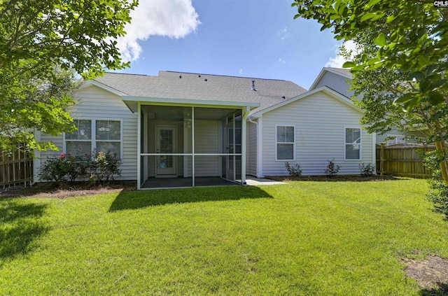 821 Burnview Ln, Chapin, SC 29036 - back of property with a sunroom, a fenced backyard, and roof with shingles