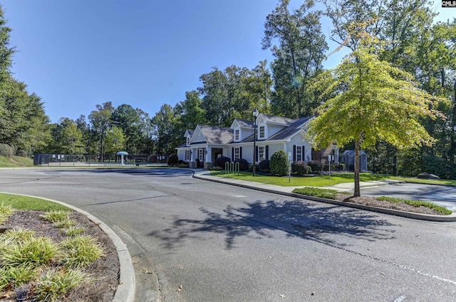821 Burnview Ln, Chapin, SC 29036 - view of asphalt road with curbs and view of scattered trees