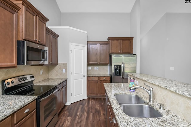 821 Burnview Ln, Chapin, SC 29036 - kitchen featuring appliances with stainless steel finishes, dark wood-style floors, backsplash, and light stone counters