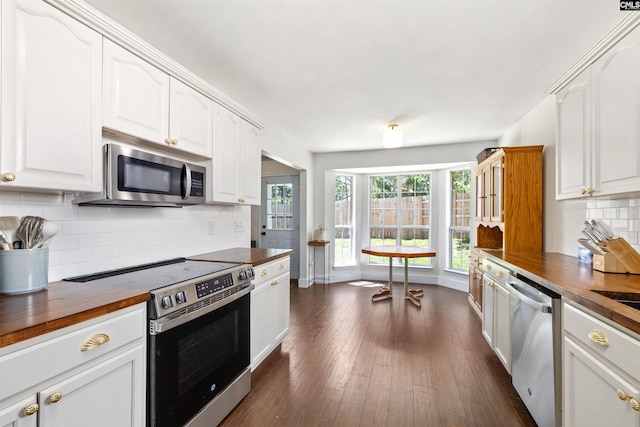 103 Faircrest Way, Columbia, SC 29229 - kitchen with stainless steel appliances, wooden counters, and white cabinetry