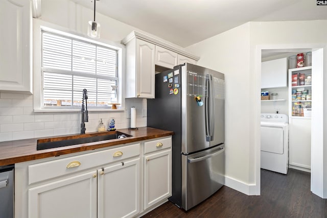 103 Faircrest Way, Columbia, SC 29229 - kitchen with washer / dryer, wood counters, stainless steel appliances, dark wood-style flooring, and tasteful backsplash