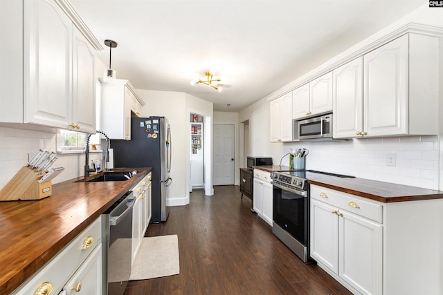103 Faircrest Way, Columbia, SC 29229 - kitchen with wooden counters, appliances with stainless steel finishes, tasteful backsplash, dark wood-style flooring, and white cabinets