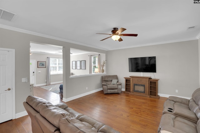 269 Creek Branch Dr, Lexington, SC 29072 - living area featuring a ceiling fan, ornamental molding, wood-type flooring, and a fireplace