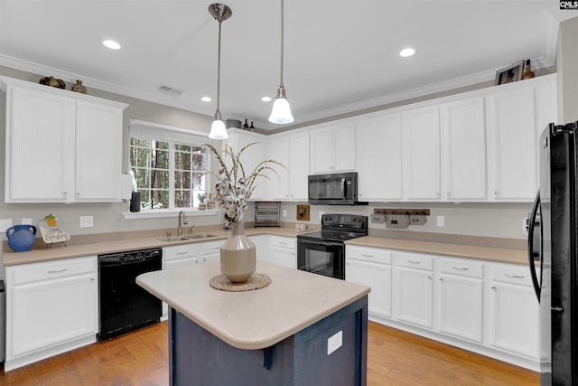 269 Creek Branch Dr, Lexington, SC 29072 - kitchen featuring black appliances, white cabinets, light countertops, ornamental molding, and pendant lighting