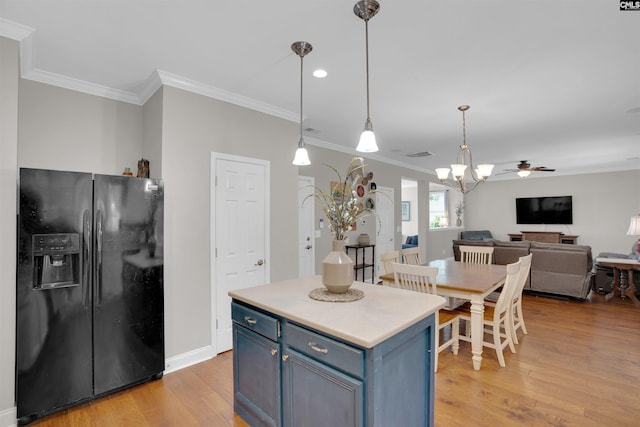 269 Creek Branch Dr, Lexington, SC 29072 - kitchen featuring black fridge with ice dispenser, blue cabinets, crown molding, light wood-type flooring, and open floor plan