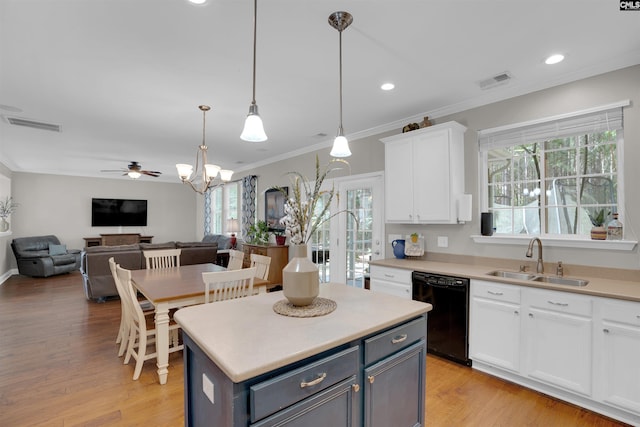 269 Creek Branch Dr, Lexington, SC 29072 - kitchen with dishwasher, ceiling fan, open floor plan, white cabinetry, and ornamental molding
