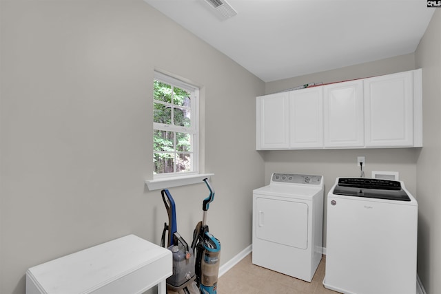 269 Creek Branch Dr, Lexington, SC 29072 - laundry area with cabinet space, washing machine and dryer, and light tile patterned floors