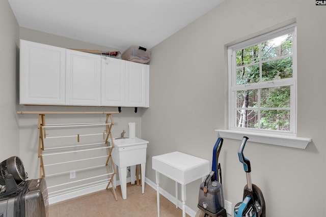 269 Creek Branch Dr, Lexington, SC 29072 - laundry room featuring light tile patterned flooring and cabinet space