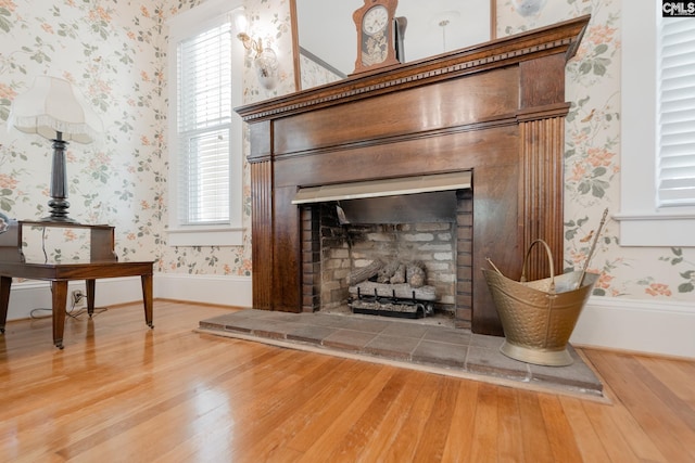 232 Boulware Rd, Lugoff, SC 29078 - detailed view of wallpapered walls, a tile fireplace, and wood finished floors