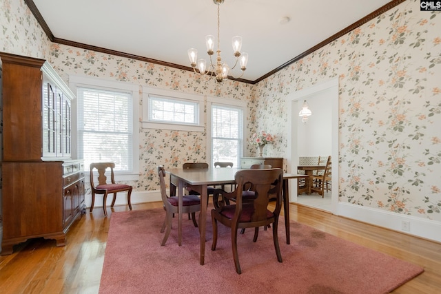 232 Boulware Rd, Lugoff, SC 29078 - dining space featuring wallpapered walls, ornamental molding, light wood-type flooring, and a chandelier
