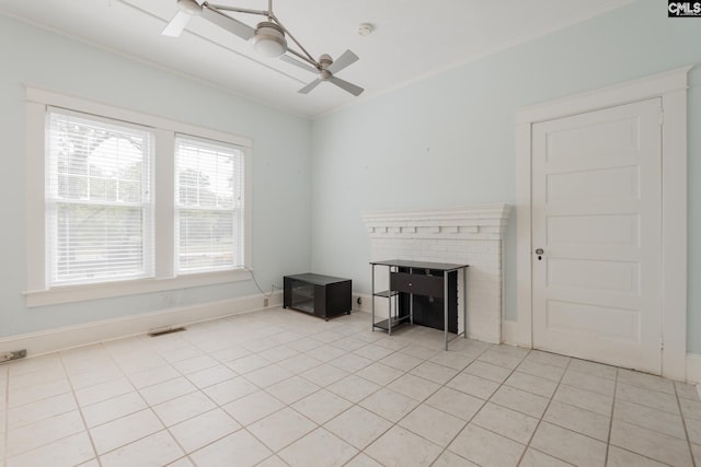 232 Boulware Rd, Lugoff, SC 29078 - unfurnished living room with light tile patterned flooring, ceiling fan, and ornamental molding