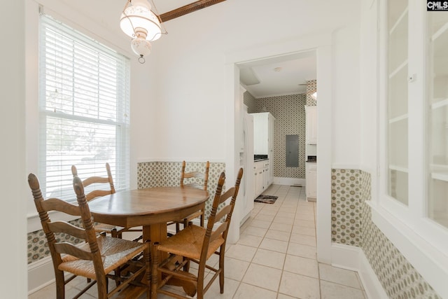 232 Boulware Rd, Lugoff, SC 29078 - dining area featuring wallpapered walls, light tile patterned floors, wainscoting, and ornamental molding
