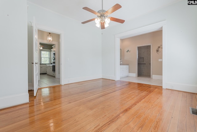 232 Boulware Rd, Lugoff, SC 29078 - spare room featuring a ceiling fan, light wood finished floors, and ornamental molding