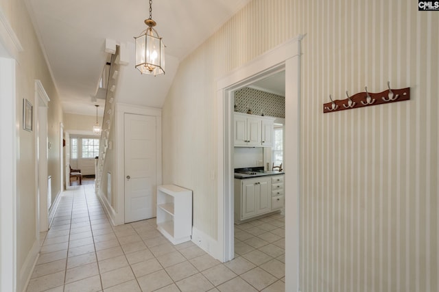 232 Boulware Rd, Lugoff, SC 29078 - hall with light tile patterned flooring, wallpapered walls, and a chandelier