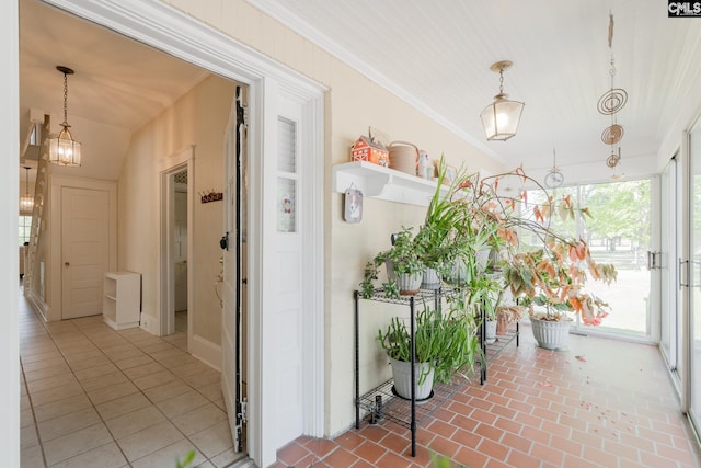 232 Boulware Rd, Lugoff, SC 29078 - corridor with crown molding, brick floors, and a chandelier