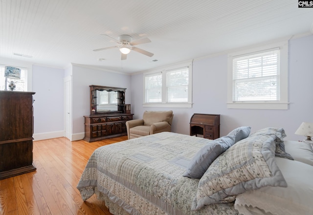232 Boulware Rd, Lugoff, SC 29078 - bedroom with light wood-type flooring, multiple windows, crown molding, and a ceiling fan
