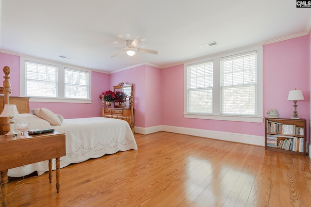 232 Boulware Rd, Lugoff, SC 29078 - bedroom featuring multiple windows, light wood-type flooring, ornamental molding, and ceiling fan